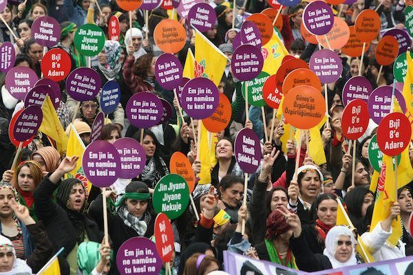 Turkish Kurd women hold placards reading