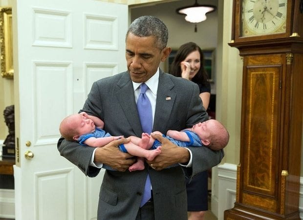 june-17-2015-the-president-carries-the-twin-boys-of-katie-beirne-fallon-director-of-legislative-affairs-into-the-oval-office-just-a-few-months-after-they-were-born-620x451